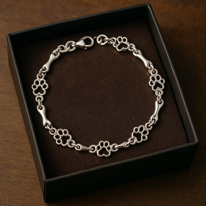Armband met hondenpoot- en botbedels in zilver