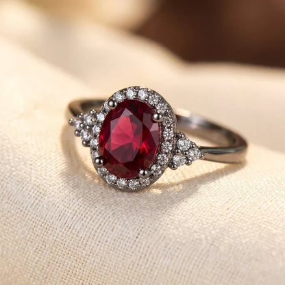 Halo ring met robijn in zilver