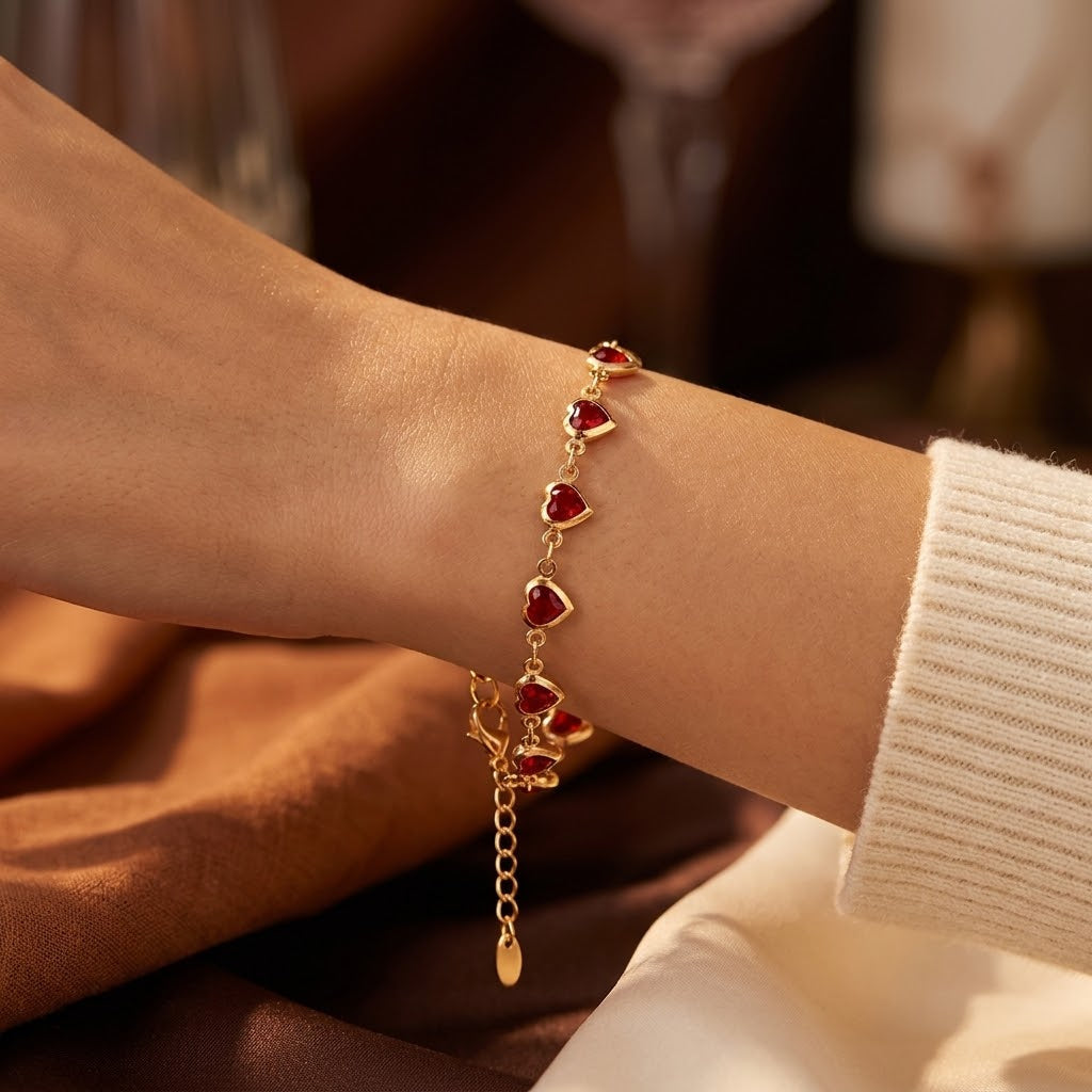 Gouden armband met hartvormige robijn